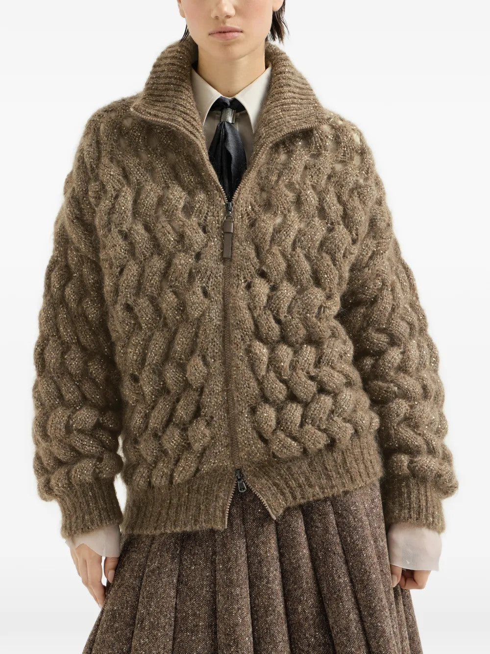Brown knitwear worn by a person, showing the knitwear fit