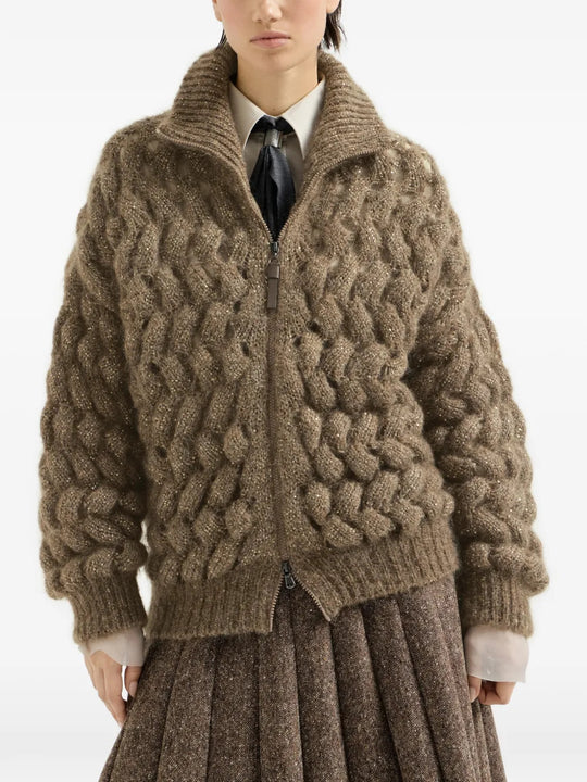 Brown knitwear worn by a person, showing the knitwear fit