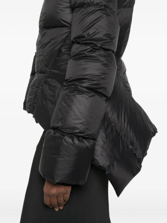 Black jacket worn by a person, showing the jacket fit