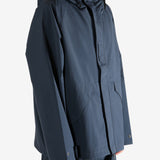 Navy jacket worn by a person, showing the jacket's fit