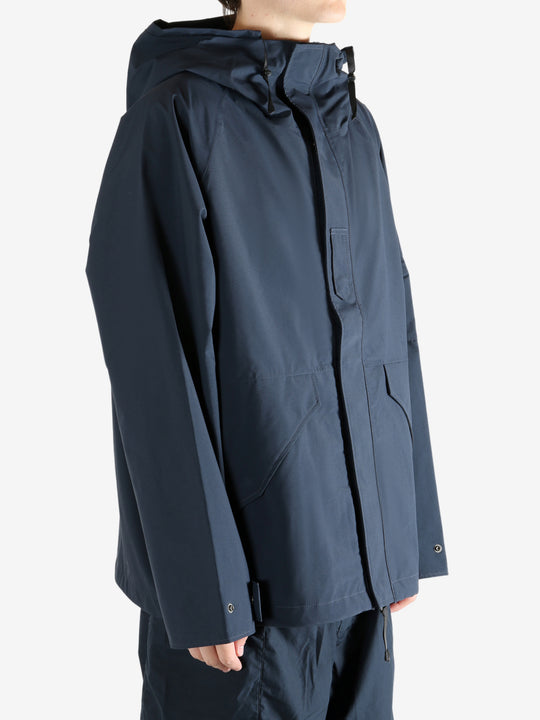 Navy jacket worn by a person, showing the jacket's fit