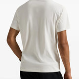 White shirt worn by a person, showing the shirt's fit