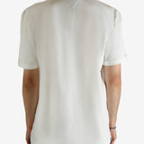 White shirt worn by a person, showing the shirt fit