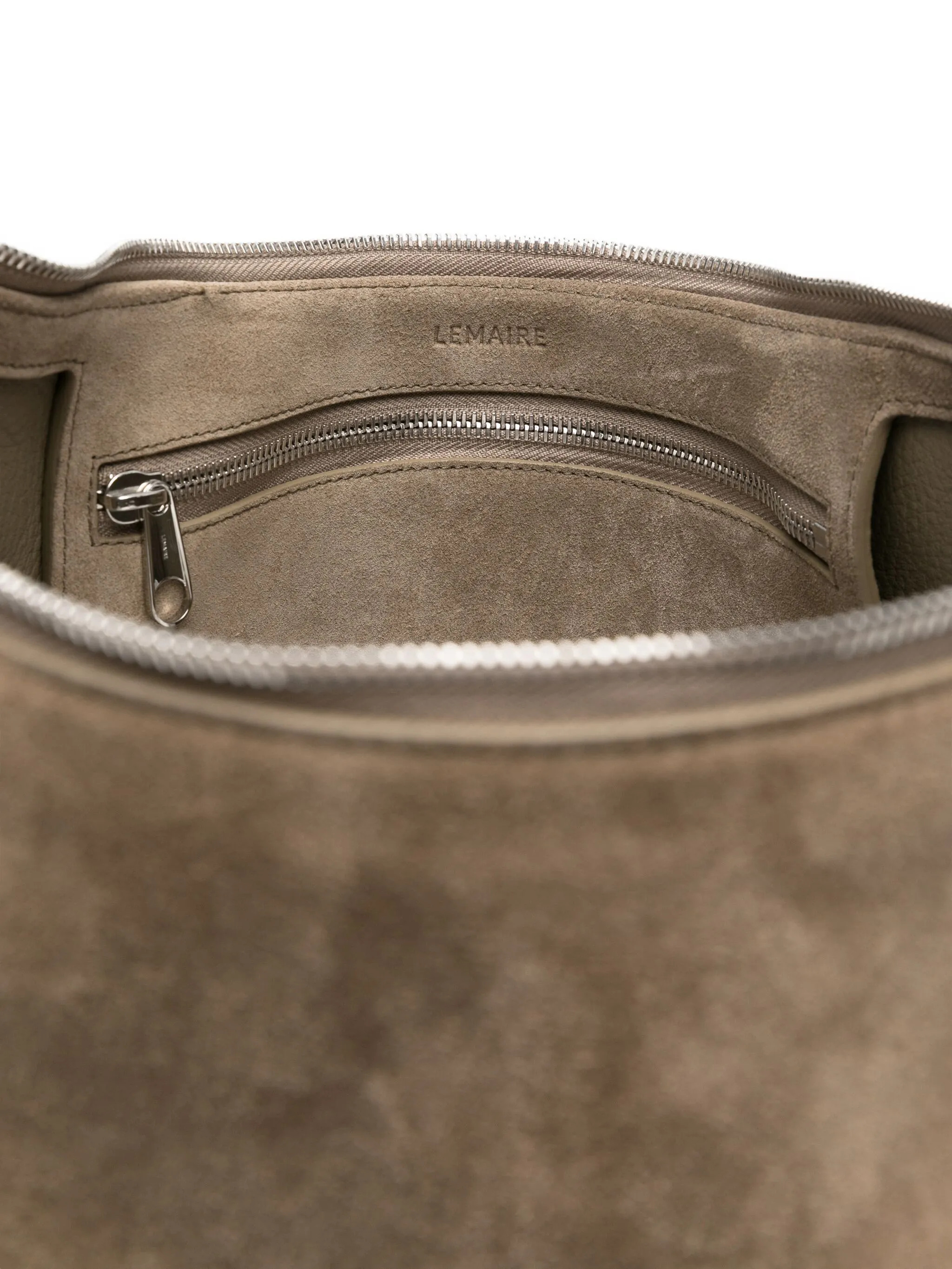 Close up of the grey bag, showing texture of the suede fabric
