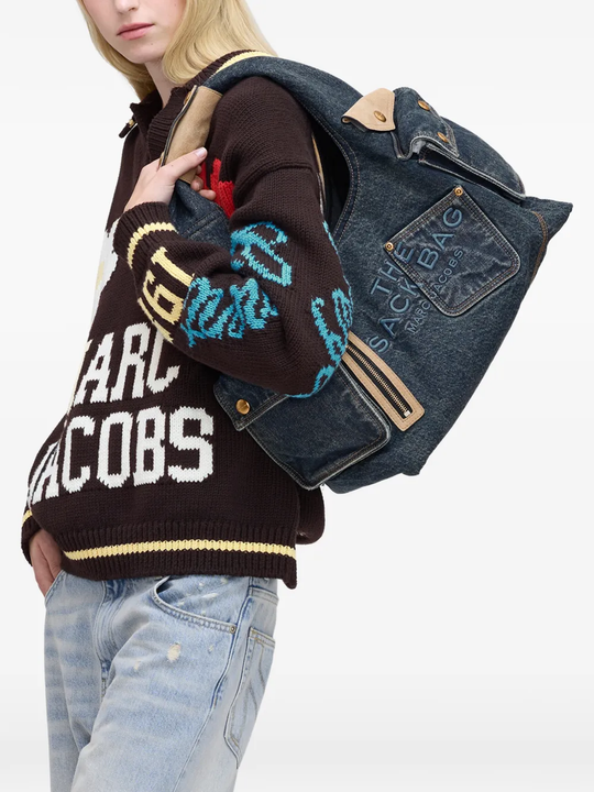 blue bags worn by a person, showing the bags fit