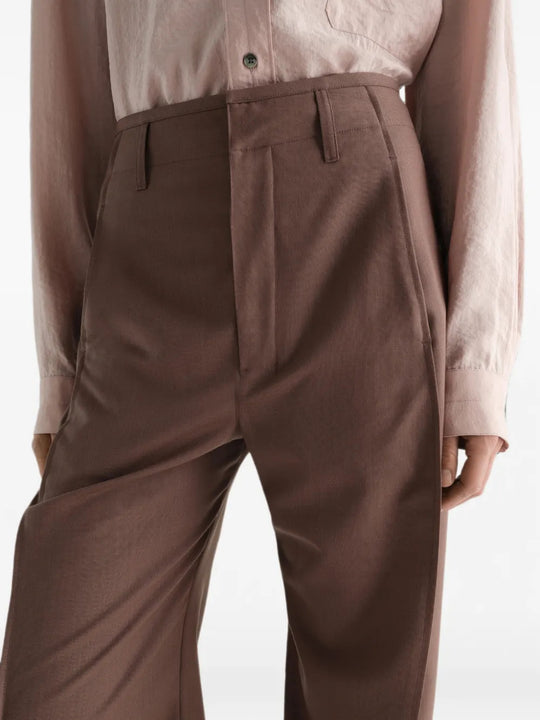 Brown pants worn by a person, showing the pants fit