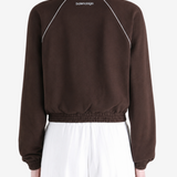 Brown jacket worn by a person, showing the jacket fit
