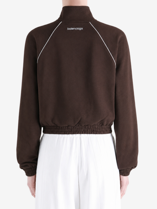 Brown jacket worn by a person, showing the jacket fit