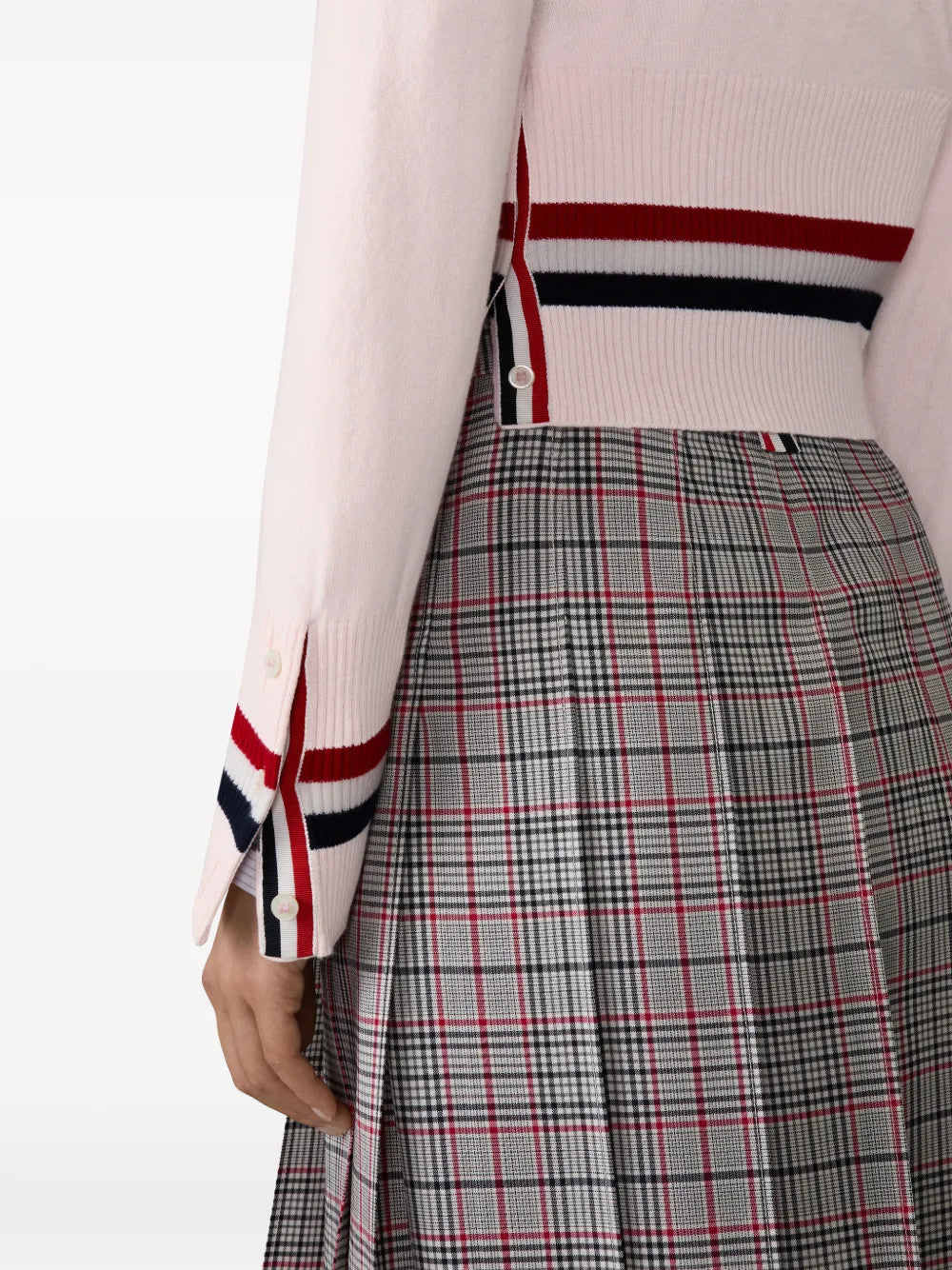 Pink knitwear worn by a person, showing the knitwear fit
