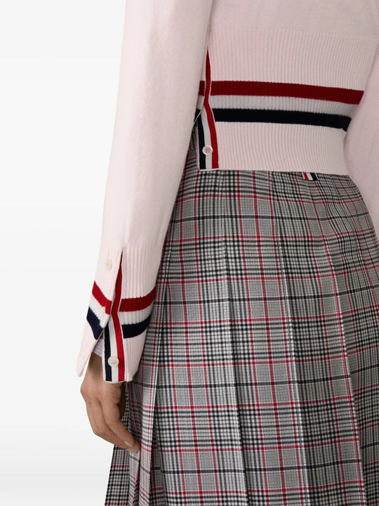 Pink knitwear worn by a person, showing the knitwear fit