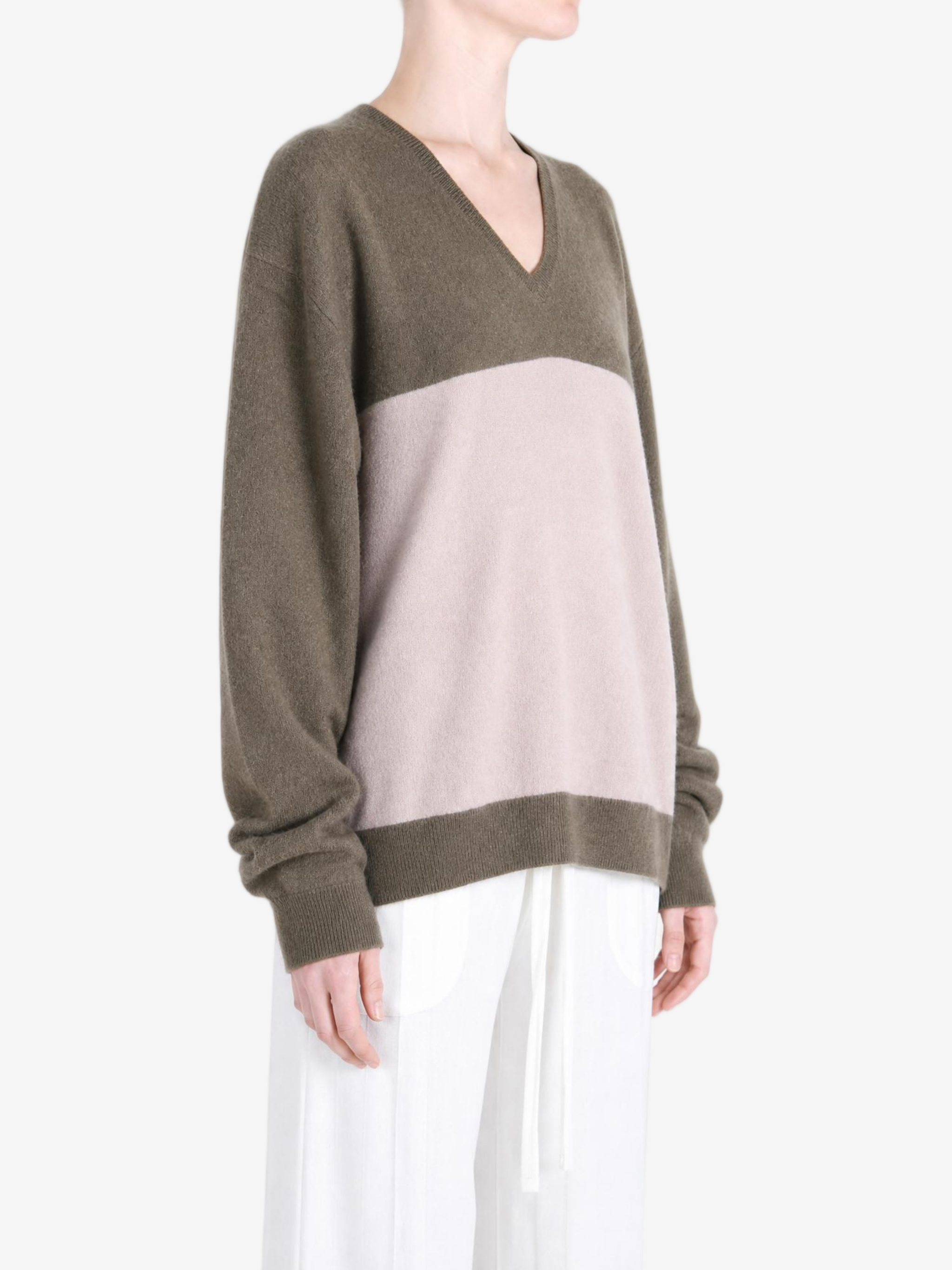 Brown hoodie worn by a person, showing the hoodie fit