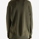 Crew knitwear worn by a person, showing the knitwear's fit