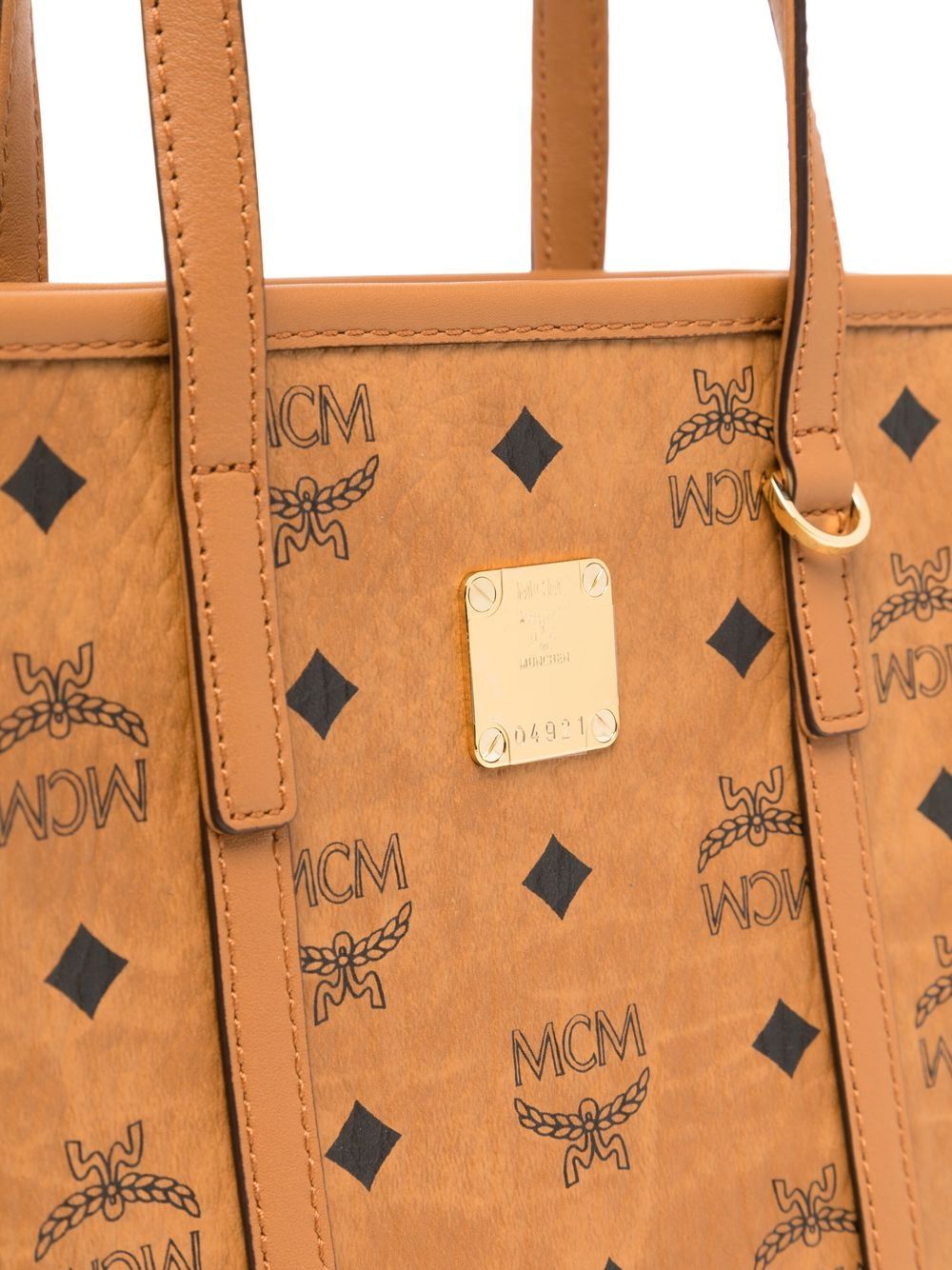 Close up of brown bag, showing texture of the leather fabric
