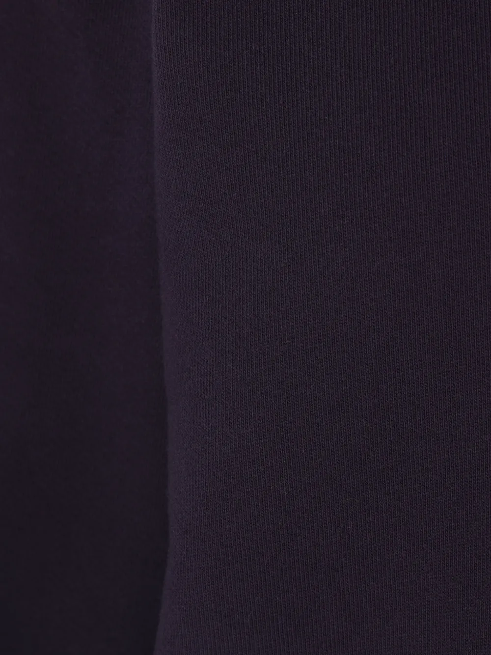 Close up of the blue sweatshirt, showing texture of the cotton fabric