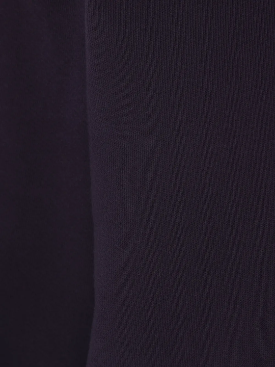 Close up of the blue sweatshirt, showing texture of the cotton fabric