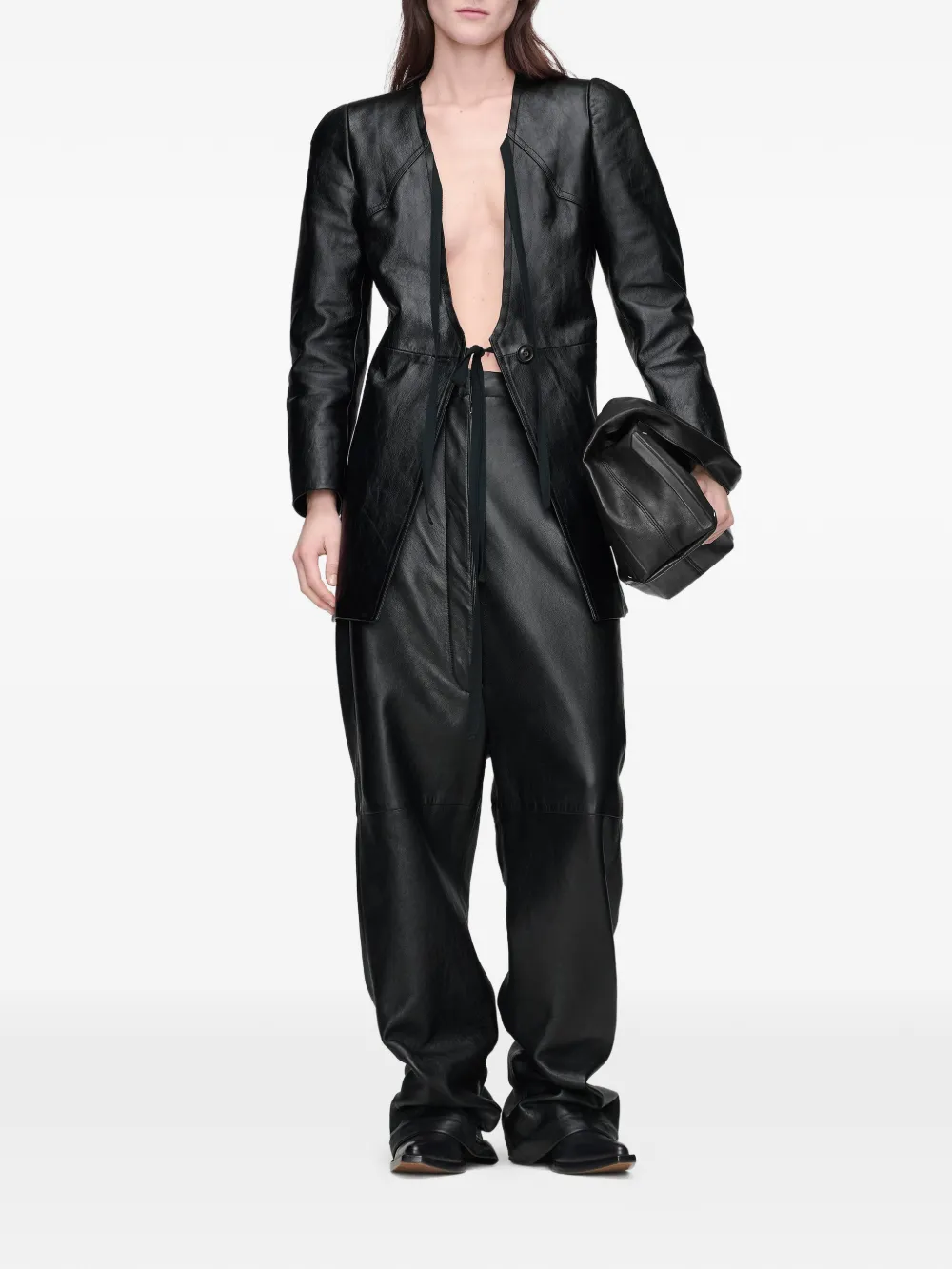 Black bag picked by a person, showing the bag fit