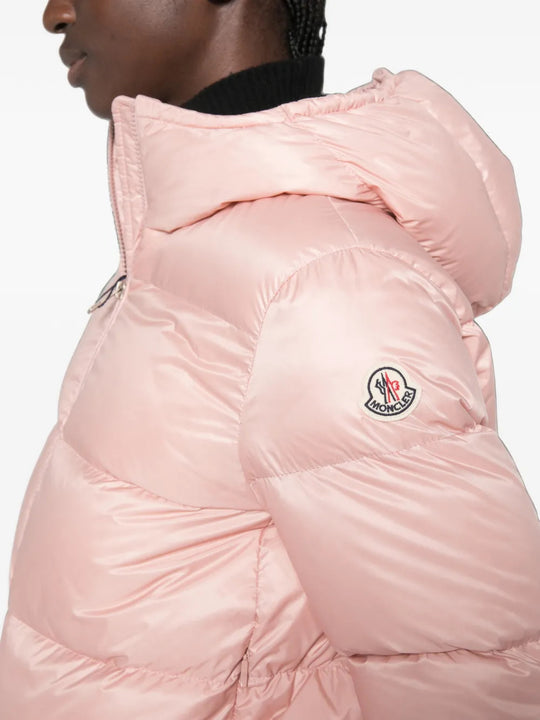 Pink jacket worn by a person, showing the jacket fit