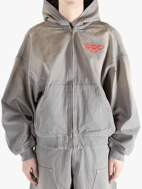 Grey hoodie, worn by a person, showing the hoodies fit