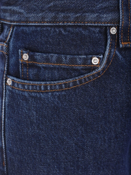 Close up of blue pants, showing texture of the cotton fabric