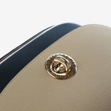 Close up of tan bag, showing texture of the cow leather fabric