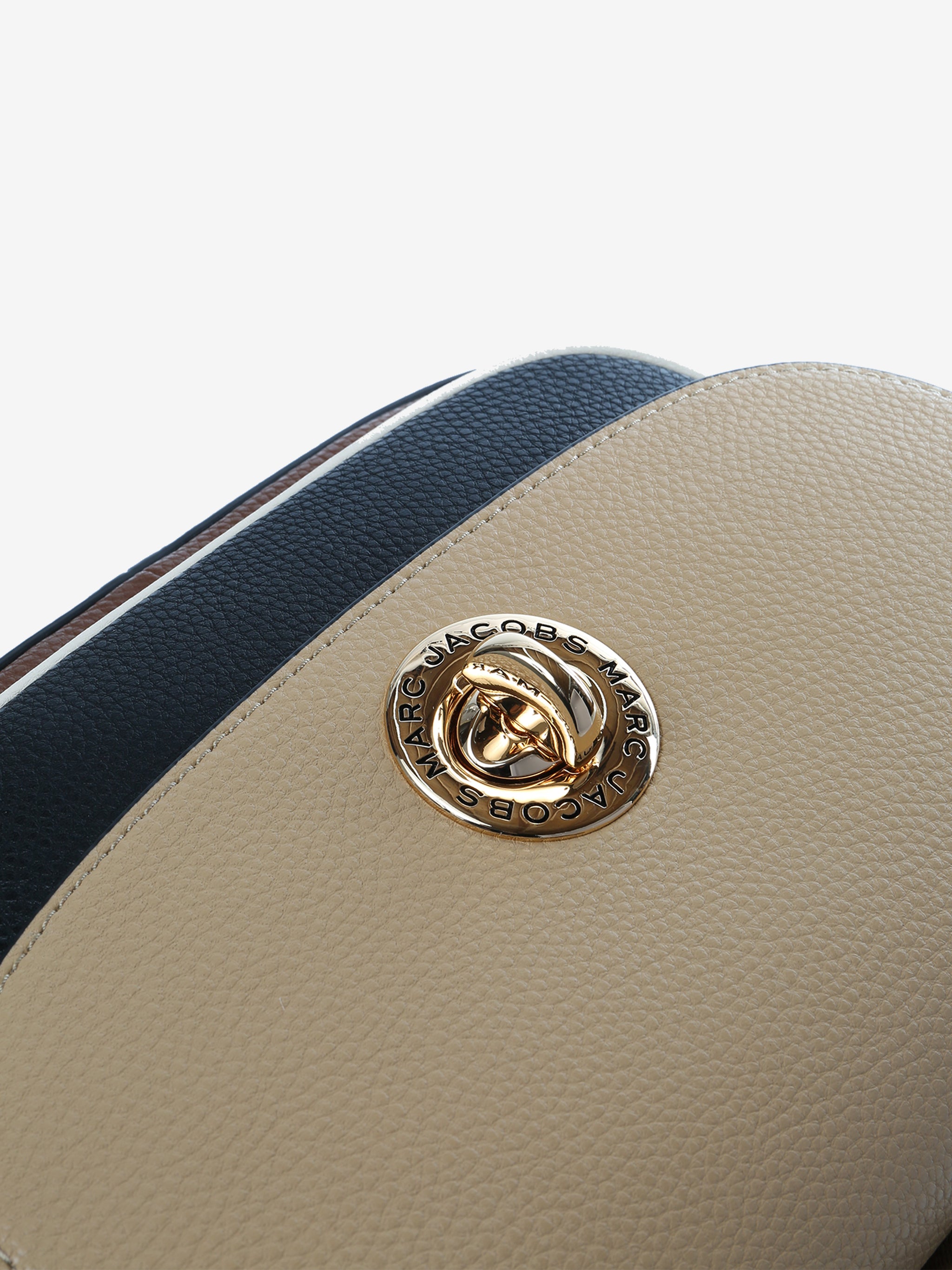 Close up of tan bag, showing texture of the cow leather fabric