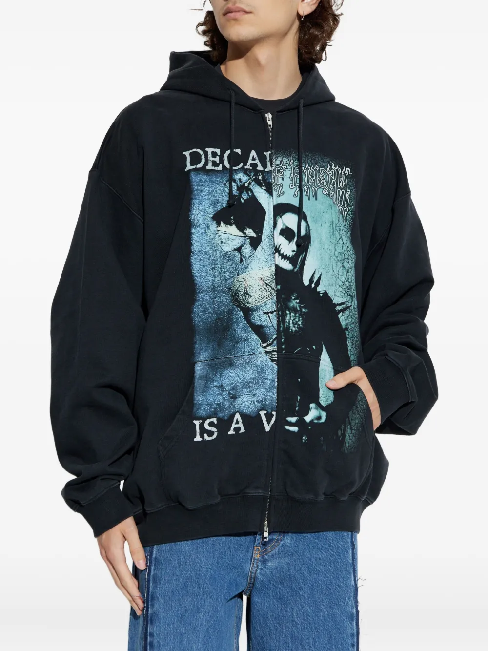 Black hoodie worn by a person, showing the hoodie fit