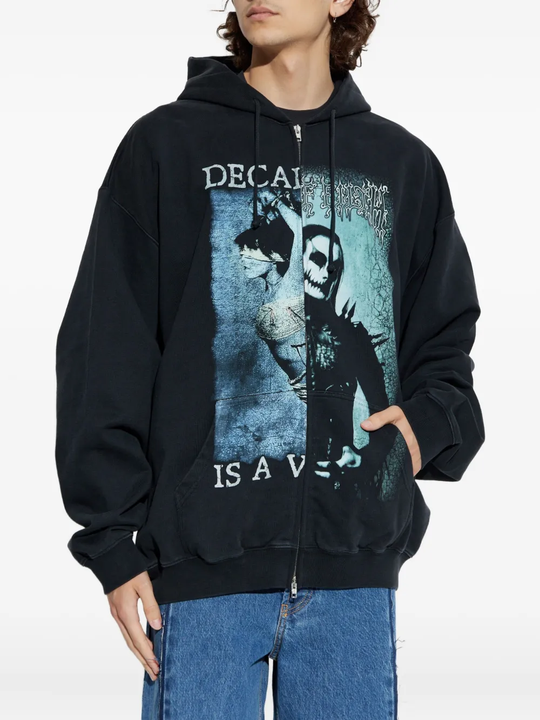 Black hoodie worn by a person, showing the hoodie fit