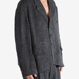 Black shirt worn by a person, showing the shirt's fit