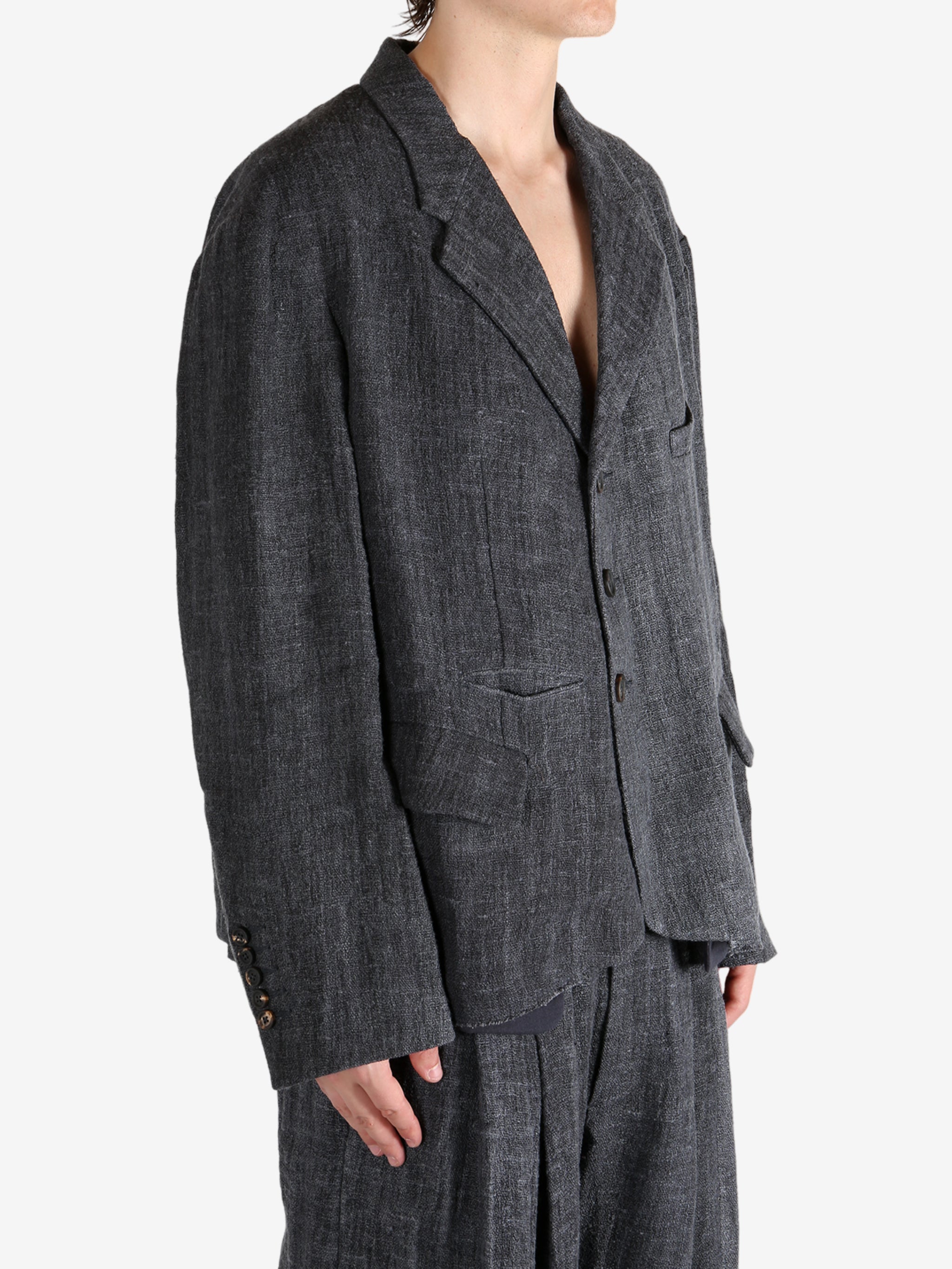 Black shirt worn by a person, showing the shirt's fit