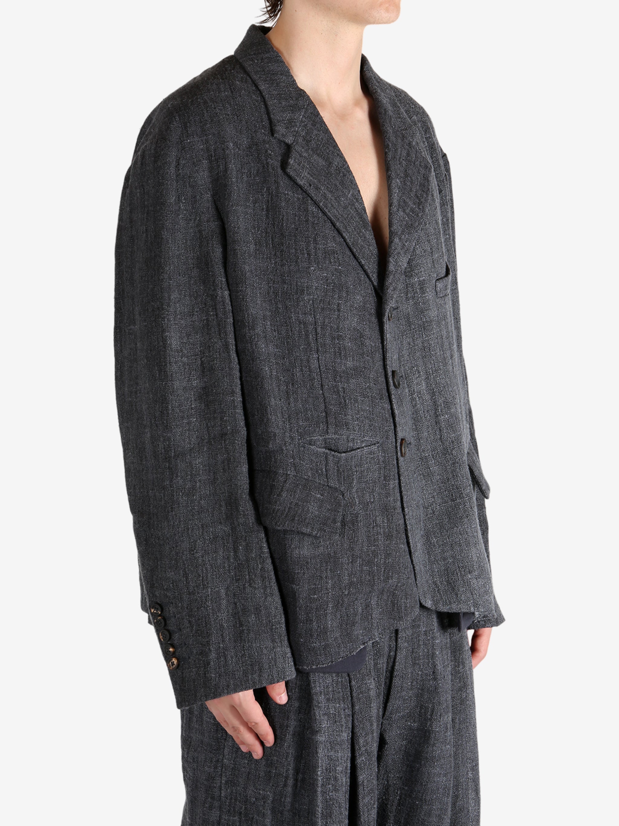 Black shirt worn by a person, showing the shirt's fit