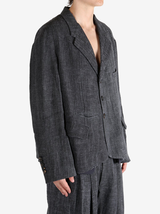 Black shirt worn by a person, showing the shirt's fit