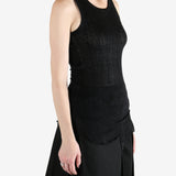 Black top worn by a person, showing the top's fit