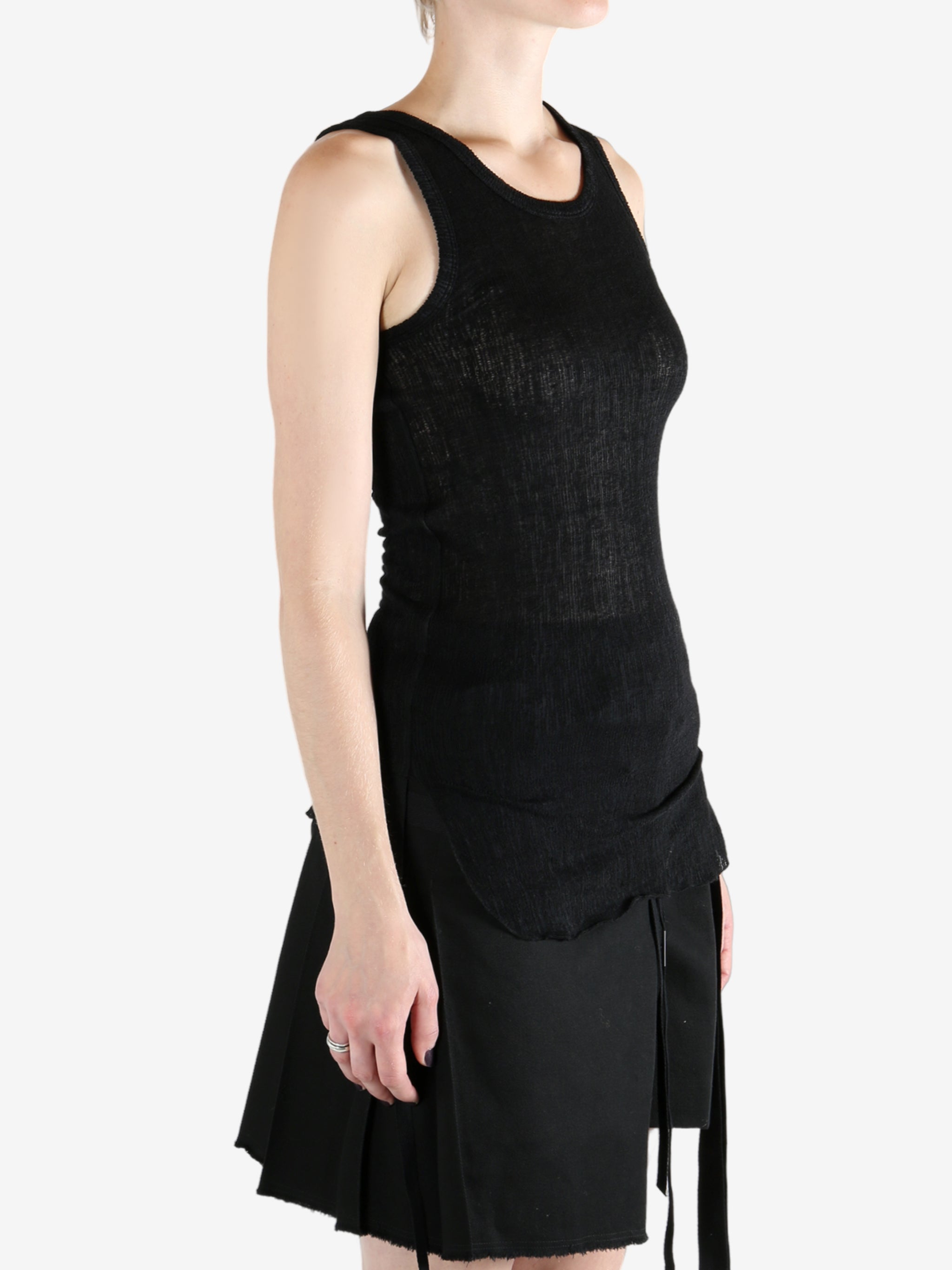 Black top worn by a person, showing the top's fit