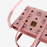 Close up of pink bag,showing texture of the leather fabric.