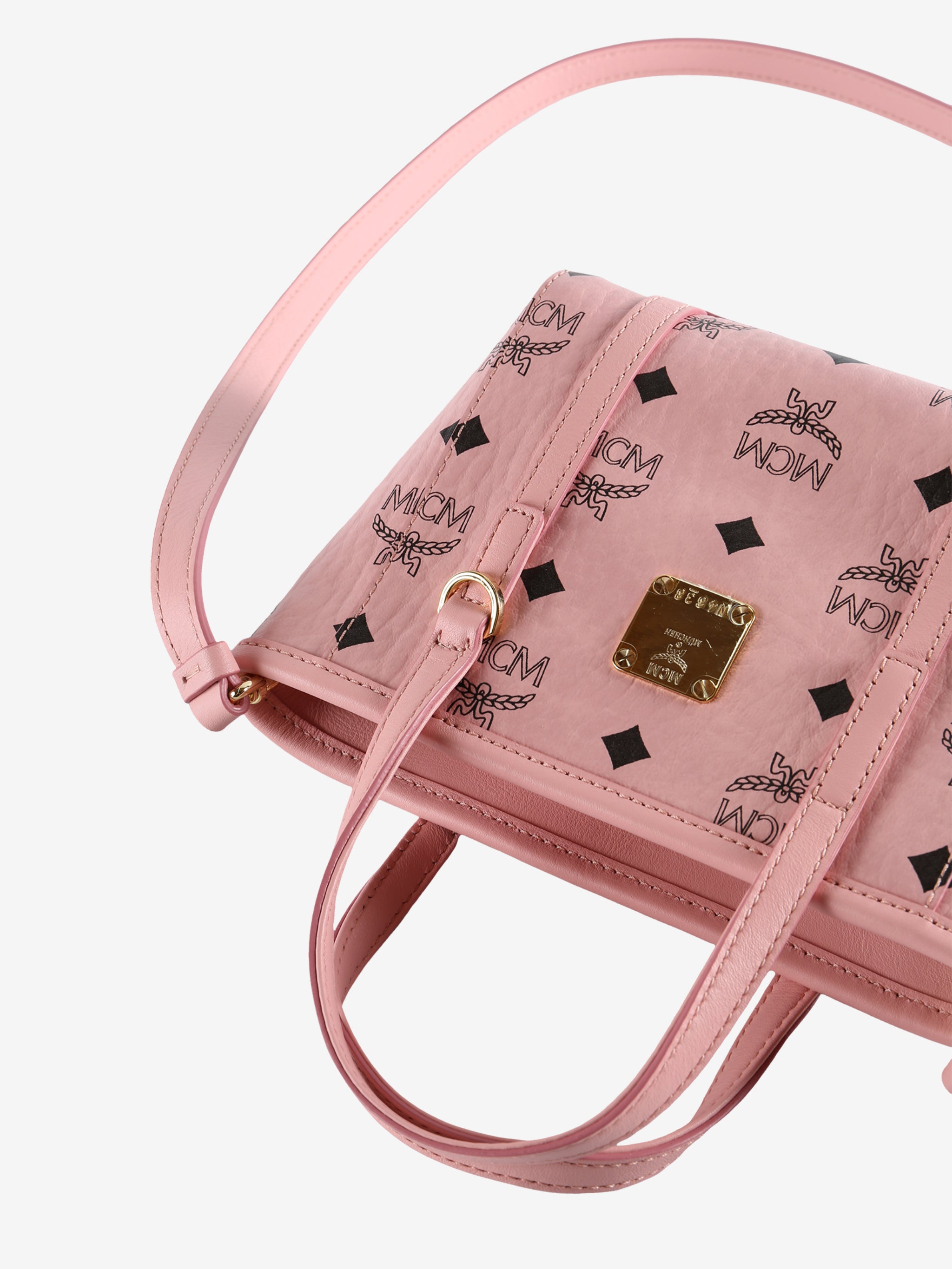 Close up of pink bag,showing texture of the leather fabric.