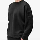 Black hoodie worn by a person, showing the hoodie fit