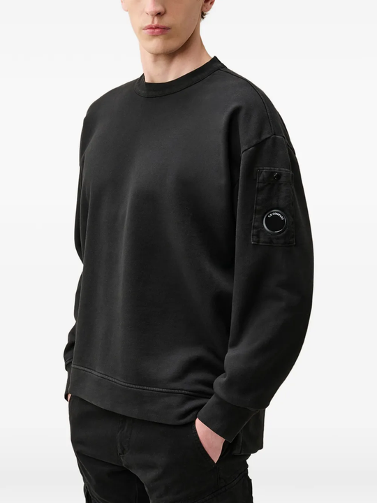 Black hoodie worn by a person, showing the hoodie fit