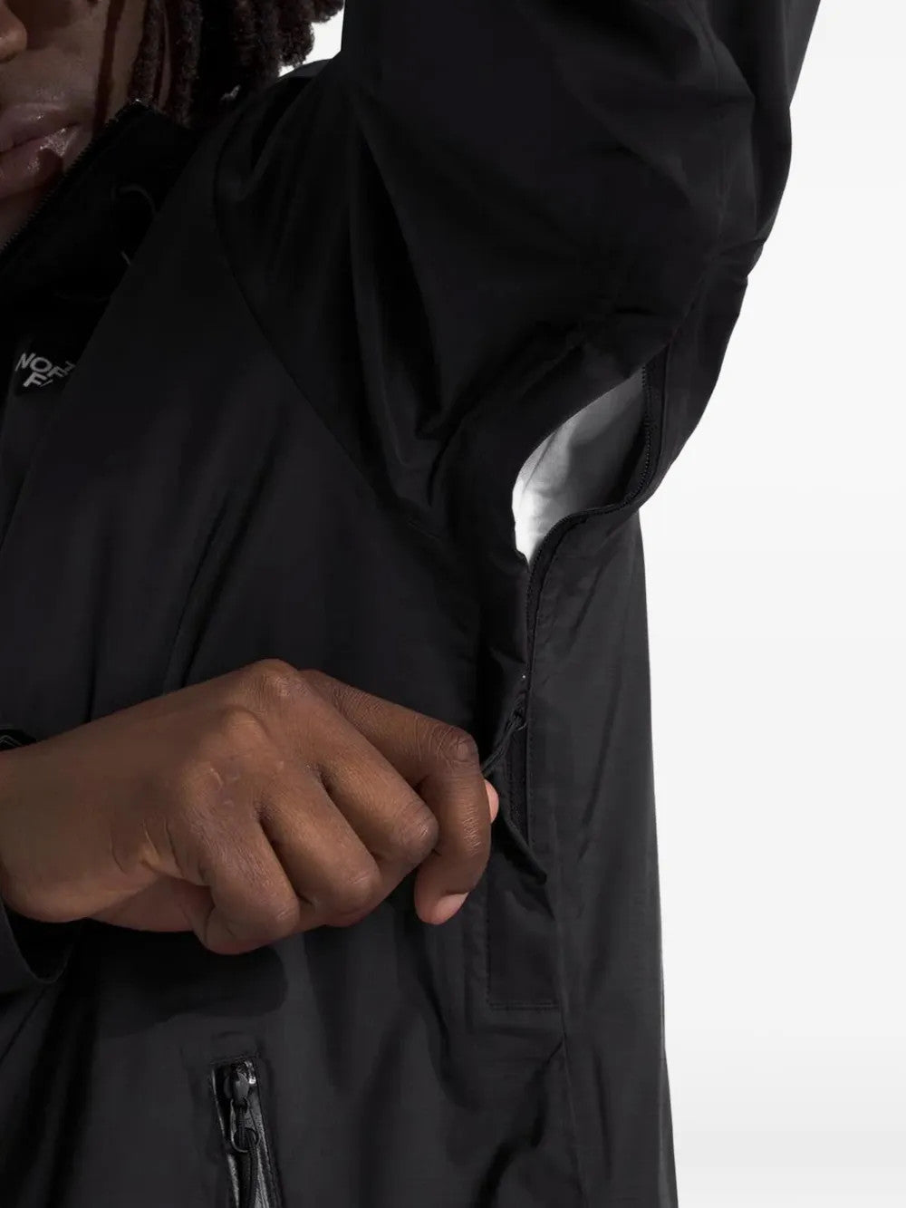 Black jacket worn by a person, showing the jacket fit