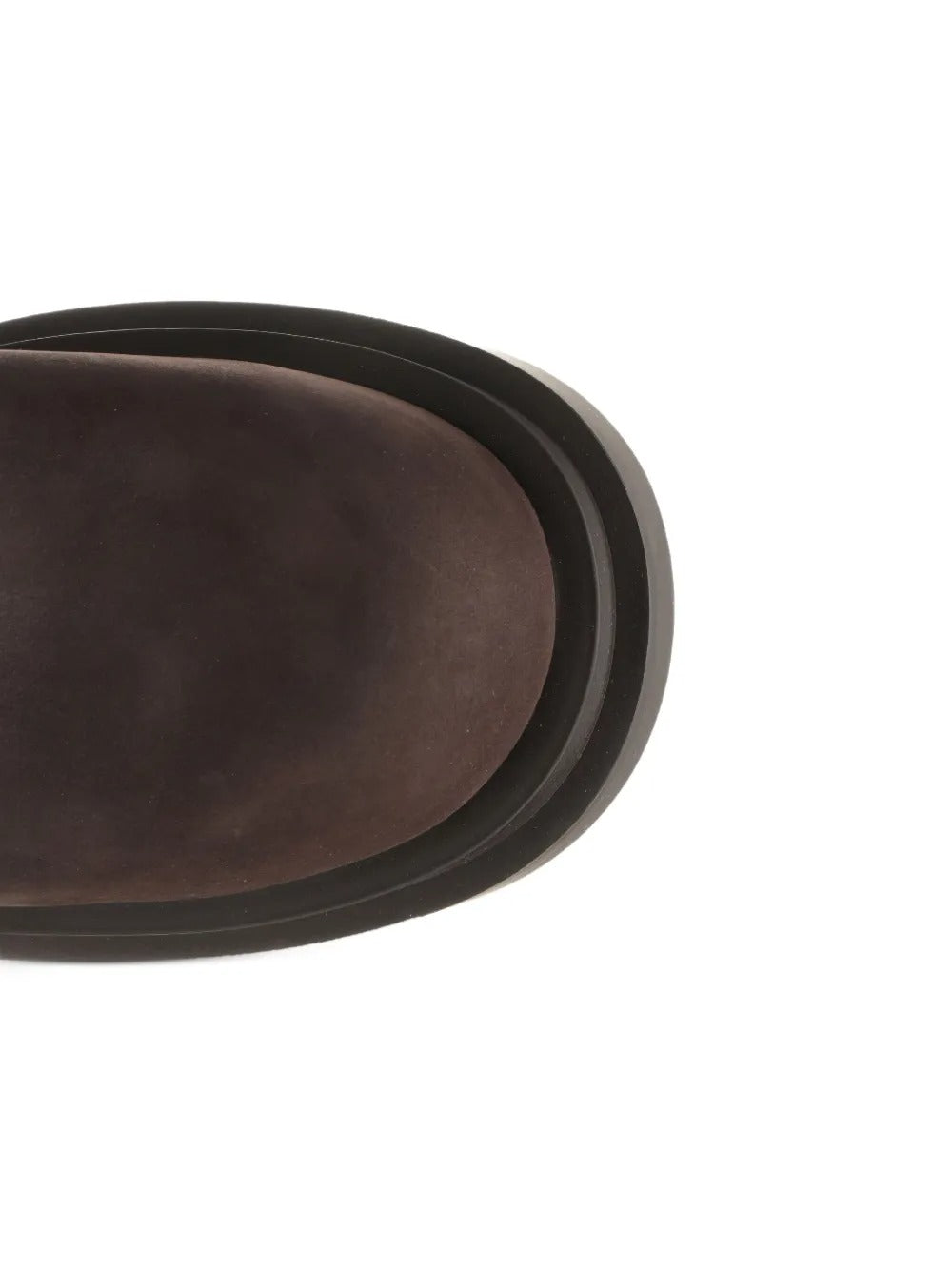 Close up of the brown boots, showing texture of the leather fabric