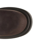 Close up of the brown boots, showing texture of the leather fabric