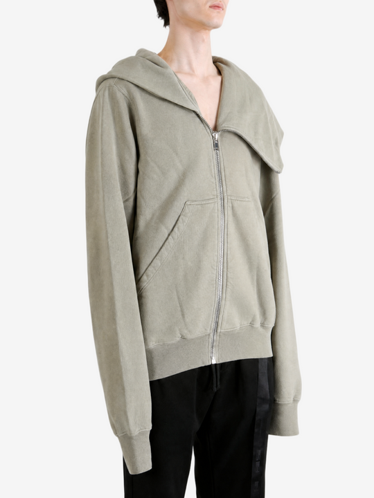 Grey hoodie worn by a person, showing the hoodie fit