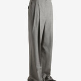 Grey pants worn by a person, showing the pants fit