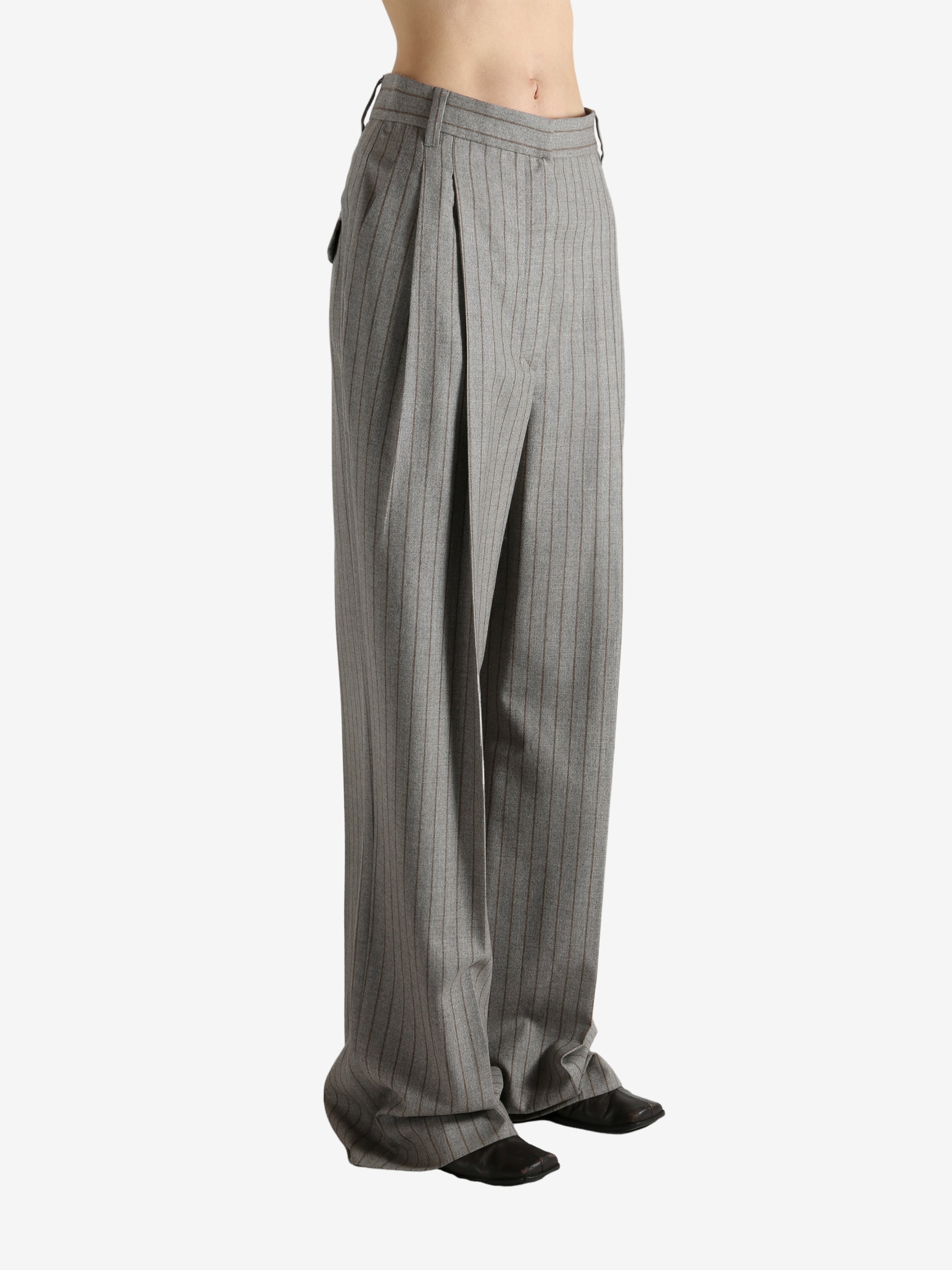 Grey pants worn by a person, showing the pants fit