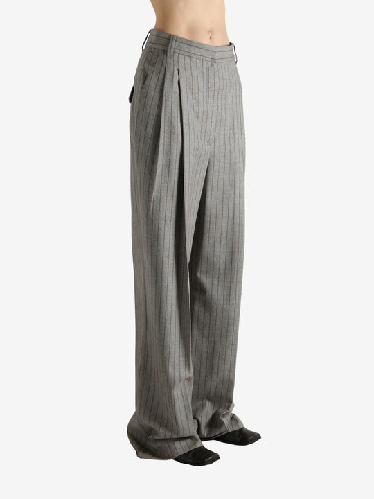 Grey pants worn by a person, showing the pants fit