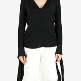 Black top worn by a person, showing the top's fit