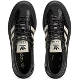 Black sneakers, vertical view
