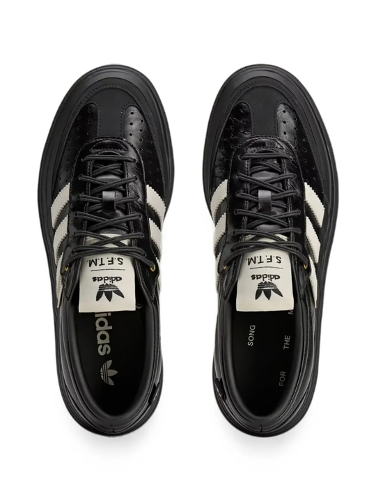 Black sneakers, vertical view