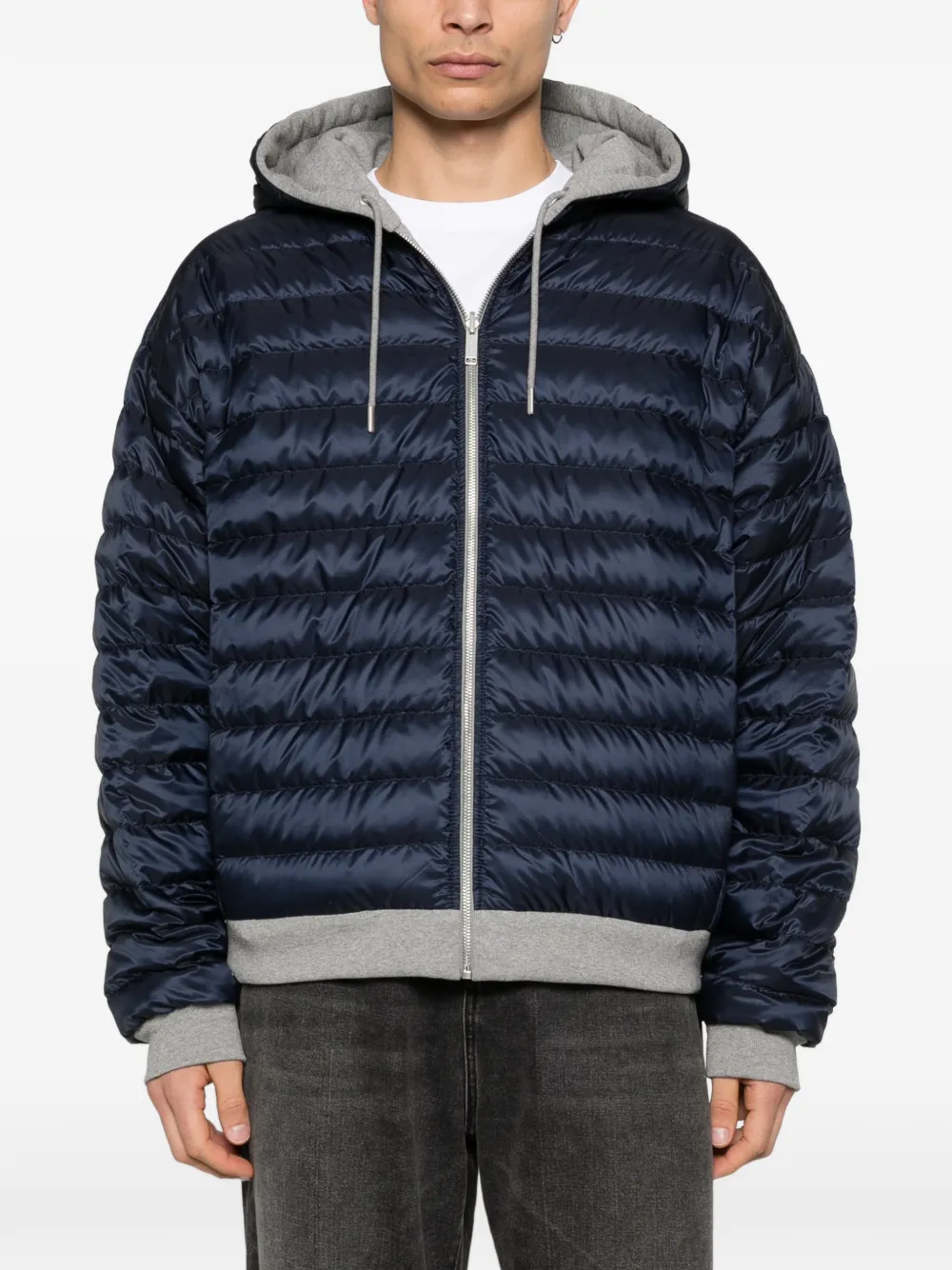Grey hoodie worn by a person, showing the hoodie fit
