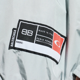 Close up of grey jackets-coats, showing texture of the cotton fabric