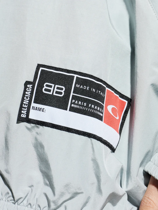 Close up of grey jackets-coats, showing texture of the cotton fabric